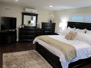 Luxurious master bedroom with 55 inch HDTV and Personal Split AC System!