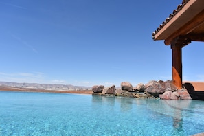 Sit in your pool overlooking Castle Rock and Lake Powell