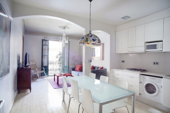 Spacious dining area, living room and totally equiped kitchen.