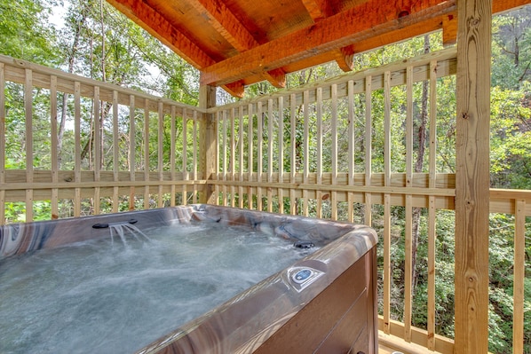 Luxuriate In The Hot Tub - The jets of steamy water are sure to relax your muscles after a day spent exploring the Great Smoky Mountains! 
