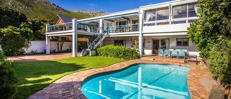 Front of the villa showing pool, garden and sundeck