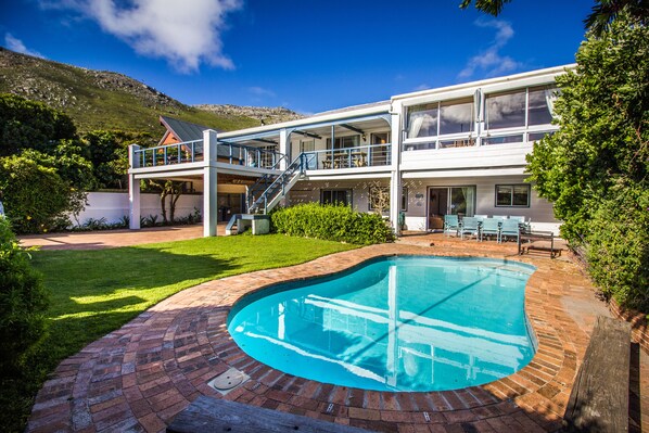 Front of the villa showing pool, garden and sundeck