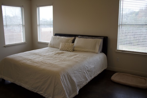 King-size bed with new linens in Master Bedroom; Doggy bed beside Master :)