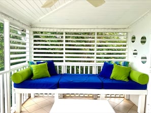 Day bed on our wrap-around screen porch with double ocean views.