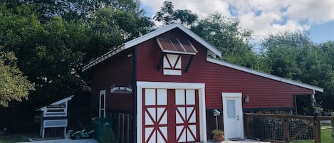 There's a parking pad to the left of the barn for easy access to the entry.