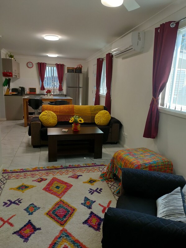 Lounge area with a large Tv with Chromecast 