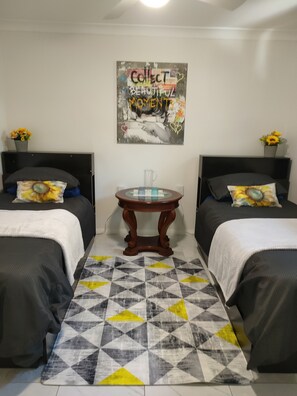 gorgeous re styled second bedroom with 2 comfortable beds 