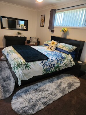 Lovely separate Master Bedroom with TV and armchair for privacy from otherguests