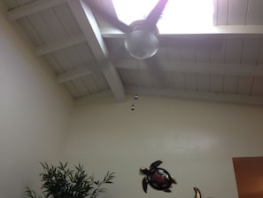 Vaulted ceilings and a vented skylight lets in natural brightness.