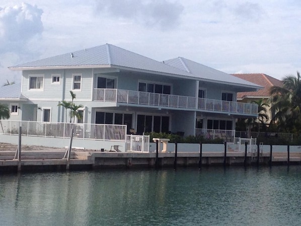 Rear of home facing canal, 50 foot dock each side, 100 feet wid if you rent both