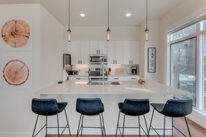 White Kitchen with Bar Seating for Four