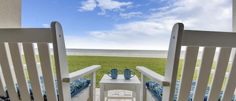 Oceanfront patio that is steps away from the surf. Enjoy the grassy backyard.