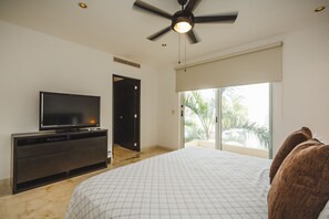 Master suite with king bed, TV and en suite bathroom