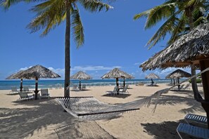 Peaceful and virtually private, the beach is groomed daily.