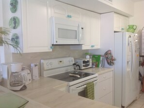The newly remodeled kitchen includes a fridge with icemaker, 