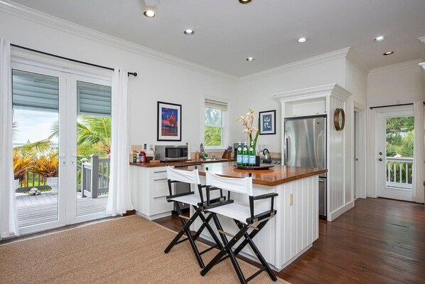 The modern kitchen features stainless steel appliances.