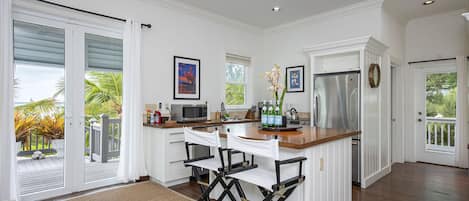 The modern kitchen features stainless steel appliances.