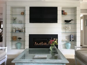 Recessed TV, Sonos sound throughout, and remote controlled fireplace