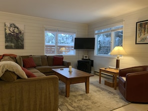 Living Room with Plenty of Seating and a Flat Screen TV