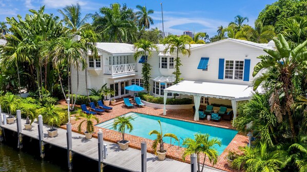 Gorgeous tropical  resort like pool area has plenty of sun and awning for shade