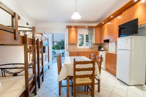 Open plan kitchen fully equipped with table seating  6 or7  persons.