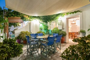 Your large private terrace where you can enjoy your coffee or drink.