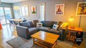 Living room with sectional and love seat. 