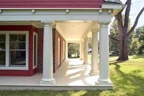 Wide wrap-around porch. Furniture has been added since photo was taken.