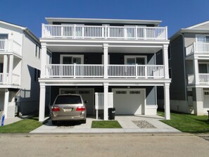 Back of duplex, VRBO garage is on the right, rear deck above garage