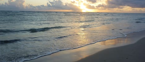 Sunrise over gentle waves right in front of the condo