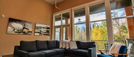 High ceiling living room with beautiful mountain view.