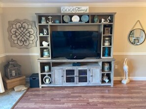 TV is right across from the couch. LOOK, no carpet means easy cleanups!