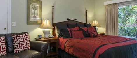 Leather love seat, coffee table and king bed with pillow top mattress.