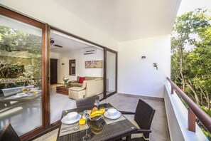 Spacious balcony with table for four