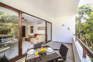 Spacious balcony with table for four