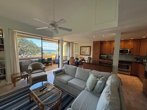 Amazing open concept kitchen area and living room leading out to your patio. 