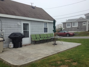 Back of house & patio. Outdoor shower to the left.