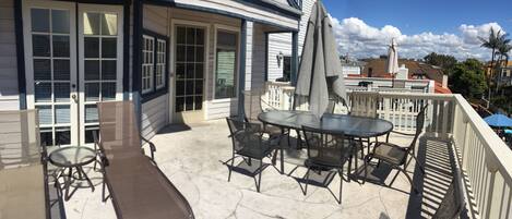 Private deck area with grill.  Umbrella table seats 8.