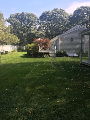 View of expansive private lawn from the back of the yard