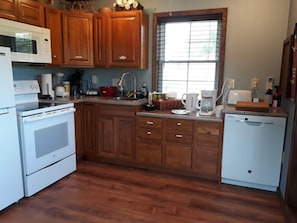 A full kitchen with all the modern conveniences. Range, microwave, dishwasher.