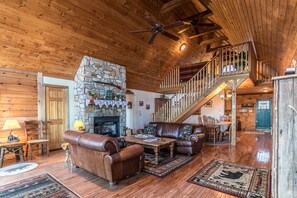 Living room with leather furniture and fireplace