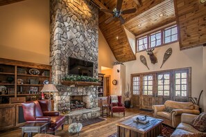 Open living room area with TV and fireplace
