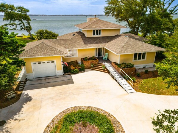 Newly paved driveway w/ ample parking for 10+ cars & basketball hoop.