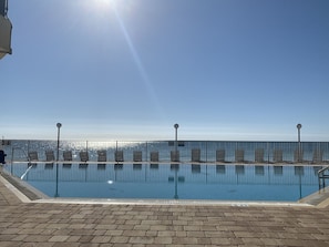 Pool with chaise lounge chairs overlooking a rare Florida Keys Beach