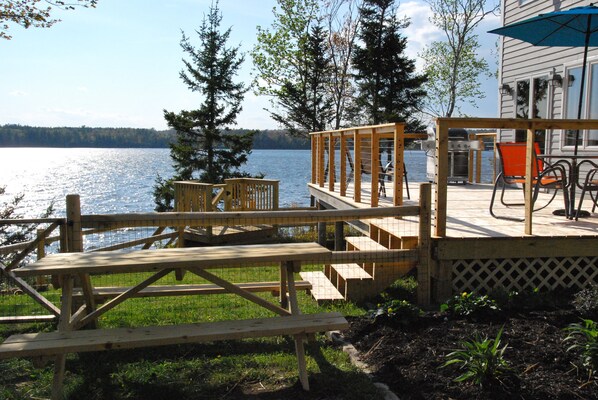 Deck with grill, large table with 8 chairs, umbrella