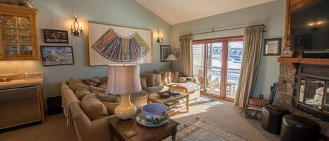 Living room and deck with views of Mt. Crested Butte