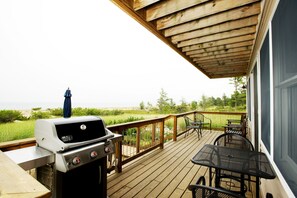 Picnic table and Weber grill convenient for outdoor dining.