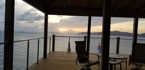 Expansive covered deck! Plenty of comfortable outdoor seating and a hammock.