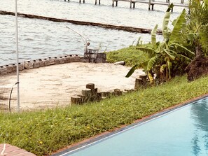 Private Beach Area below the pool