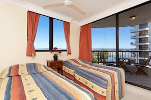 Second bedroom - two single beds- own private balcony - sunset & river views.